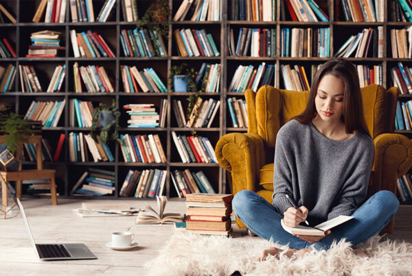 girl in front of bookshelves