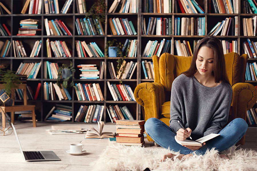 girl in front of bookshelves