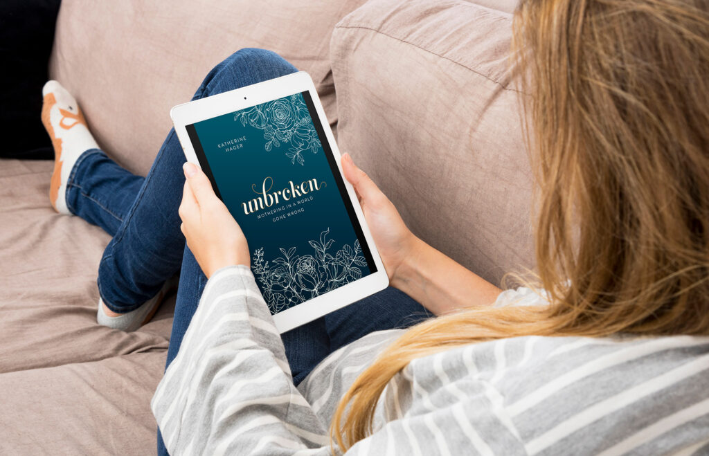 Woman reading "Unbroken" eBook on her tablet