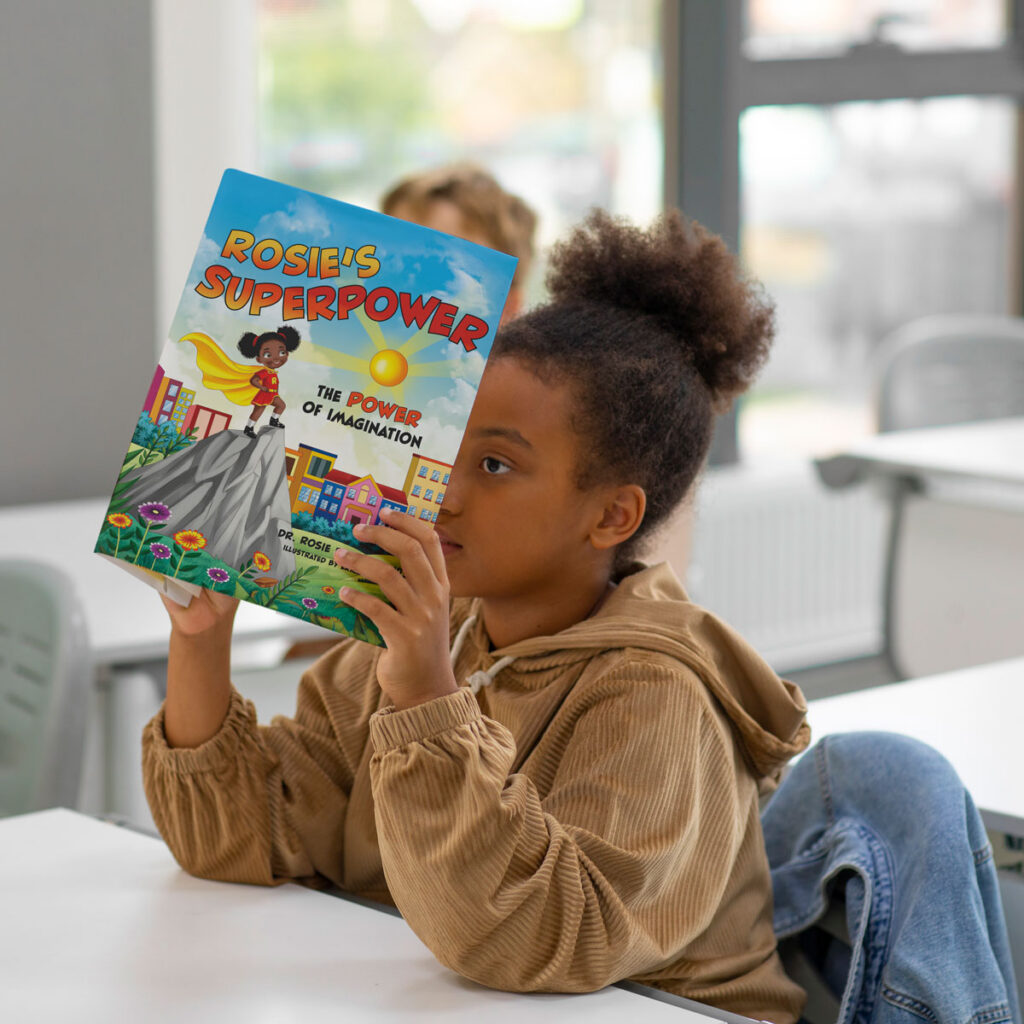 girl holding a copy of a superhero children's book