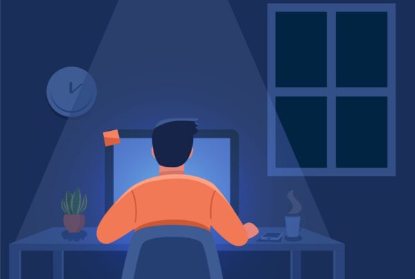 Book designer at desk, utilizing InDesign scripts