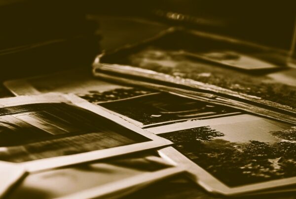 historic old photos lying on a tabletop with a sepia tone